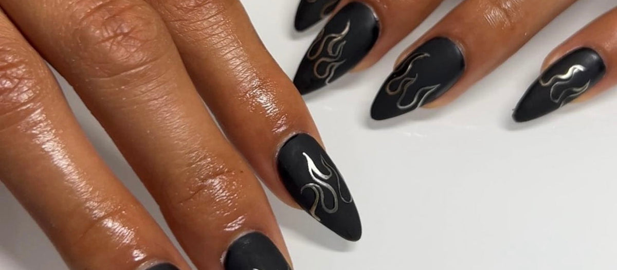 Matte black almond nails with silver flames, Halloween nail art in vegan gel polish